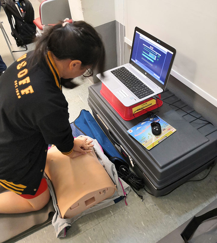 Practicing CPR using the Little Anne QCPR. The statistics measured more objective, and also easier to "game".